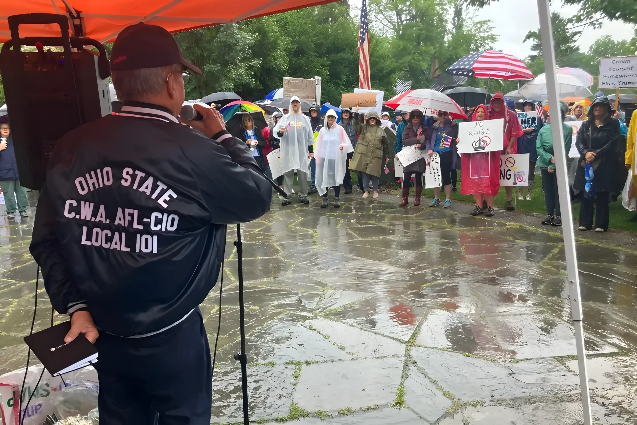 Bill O'Neill speaking to a crowd at a protest.